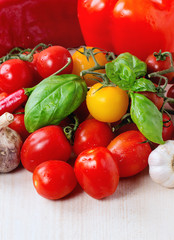 Fototapeta na wymiar Assortment of tomatoes and vegetables