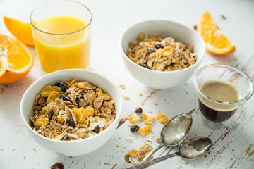 Breakfast - muesli and fruits on white background