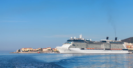 Big white cruise ship moored in port of Ajaccio