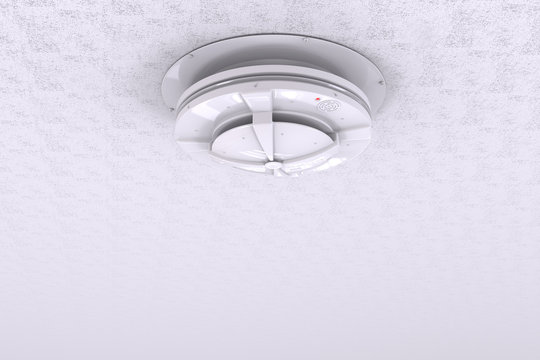 3d rendered smoke detector on ceiling with blank space