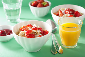 healthy breakfast quinoa with strawberry banana coconut flakes