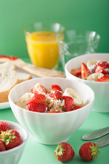 healthy breakfast quinoa with strawberry banana coconut flakes