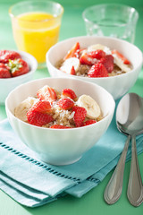 healthy breakfast quinoa with strawberry banana coconut flakes
