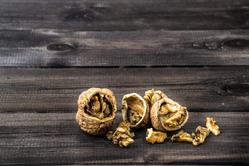 Walnuts on a wooden background.