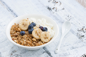 healthy breakfast with cottage cheese, granola and fresh berries