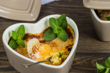 Creme brulee (cream brulee, burnt cream) with mint