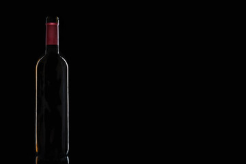 bottle of wine on a black background