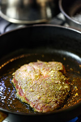 Beef steak fried in the pan.