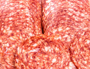 Background, texture of salami slices, close-up