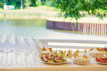 plates of vegetables and cheese  and wine glasses