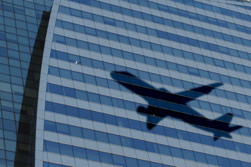 Plane shadow on building background