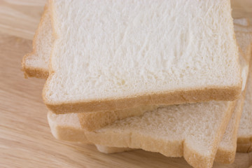 Whole wheat bread on wooden table.