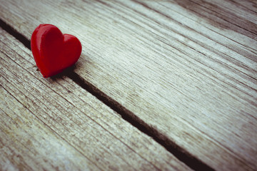 Photograph of two hearts on wooden surface