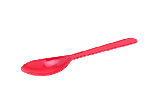 Plastic spoons red on white background.
