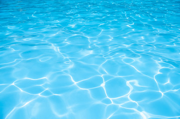 Naklejka na ściany i meble Beautiful gentle wave in swimming pool with sun reflection
