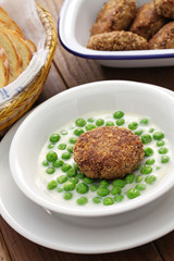 green peas fozelek (thich vegetable stew) and fasirt (fried meatball), hungarian cuisine