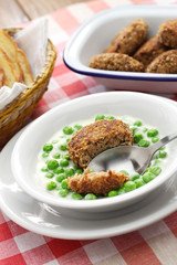 green peas fozelek (thich vegetable stew) and fasirt (fried meatball), hungarian cuisine