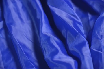 folds on blue satin  fabric