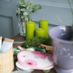 Florist workplace: flowers and accessories on a vintage wooden table. soft focus