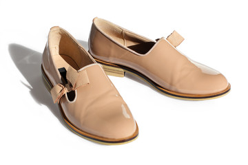 classic beige shoes from a patent leather with a small heel