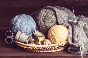 knitting, tangles scissors and coils in a basket