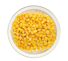 Sweet yellow corn grain on plate isolated on white background