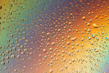 macro shot of liquid droplets with reflection. color background with water drops texture. gradient color