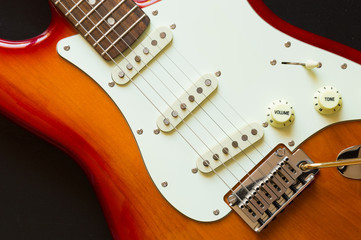 Fototapeta na wymiar Red rock music electric guitar closeup for music hobby concept