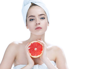 Lovely girl with pomelo slice, natural organic raw fresh food concept / photos of appealing girl on white background