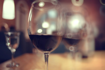 glass of wine, a restaurant serving a blurred background