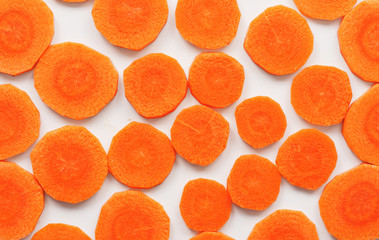 sliced carrots rings on white background