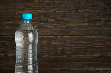 Small bottle of clean water with drops