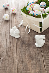 Basket with easter eggs and easter bunnies