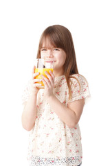 Cute girl drinking orange juice