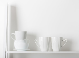 Clean dishes on wooden shelf