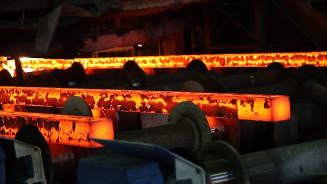 red-hot steel on conveyor