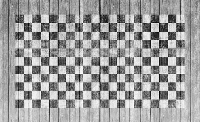 Checkered finish flag on grungy wood plank background