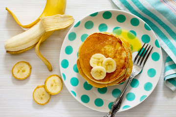 Fototapeta na wymiar Traditional American banana pancakes, top view.