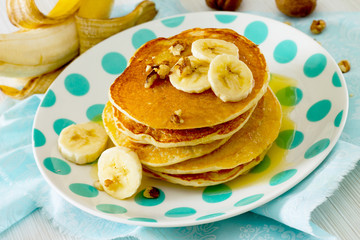 Fototapeta na wymiar American Banana Pancake with honey and walnuts