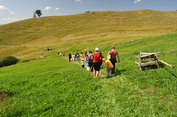 Fototapeta na wymiar people in summer mountains, tourists