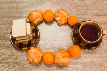 Chocolate waffles with tea, tangerines