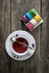 Cup of tea and colorful macaroons