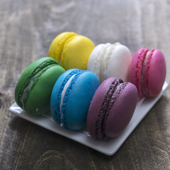 Colorful macaroons  on wooden background