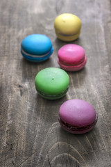 Colorful macaroons  on wooden background