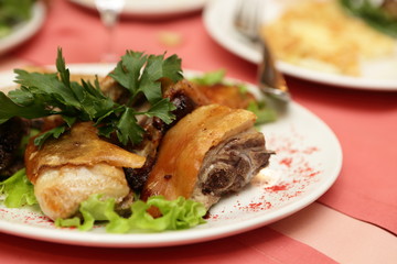 Pieces of suckling pig on a plate
