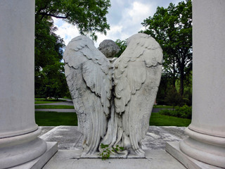 Majestic angel with wings on unknown tomb - landscape color photo