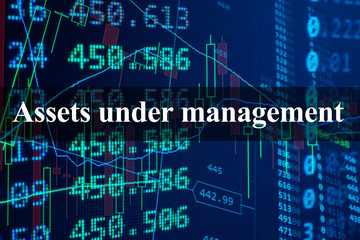 Words  Assets under management with the financial data on the background. 