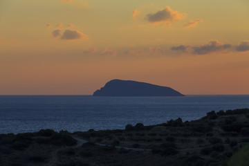 Naklejka na ściany i meble View of the beach on the island of Crete at sunset. Greece.