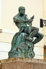 Naklejka premium Fisherman with Snake, statue