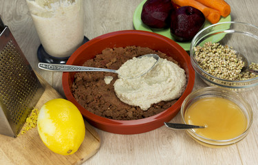 Preparation of raw vegan berry cheesecake gluten-free on a brigh